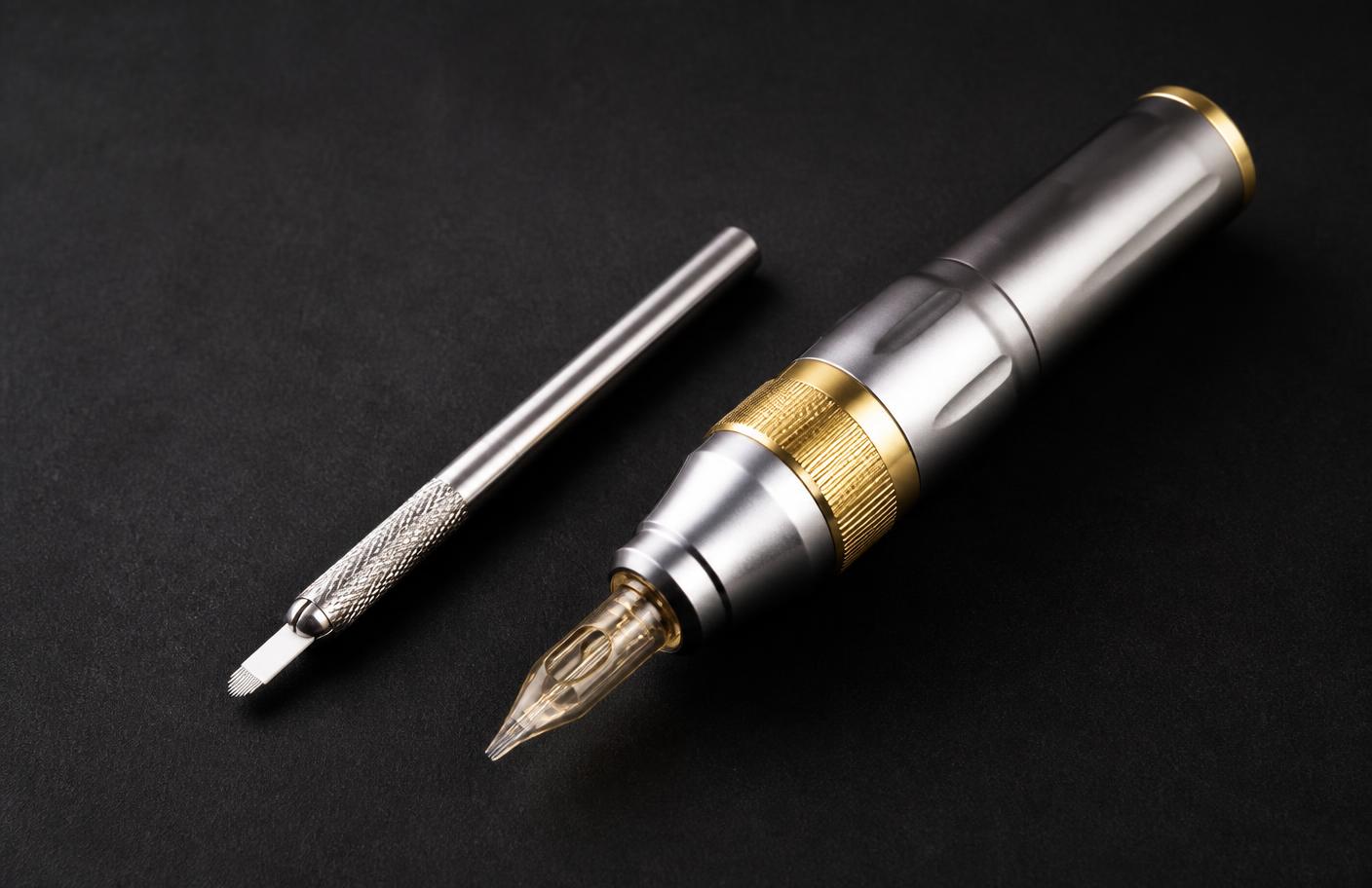 Manual nanoblade tool beside a rotary PMU pen with nano cartridge