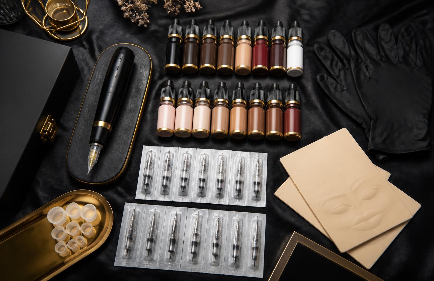 Complete PMU starter kit laid out with machine, pigments, cartridges and practice skin